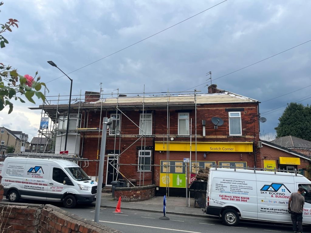 Flat roof installation over commercial corner unit — Before