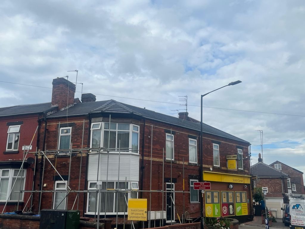 Flat roof installation over commercial corner unit — After